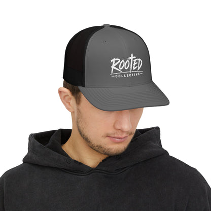 THE ROOTED COLLECTIVE TRUCKER CAP
